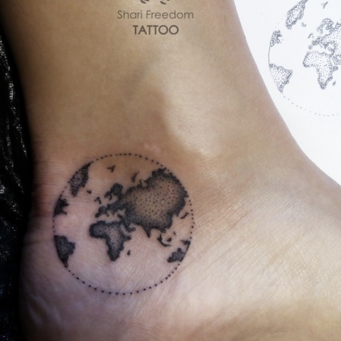 dotwork earth traveling tattoo